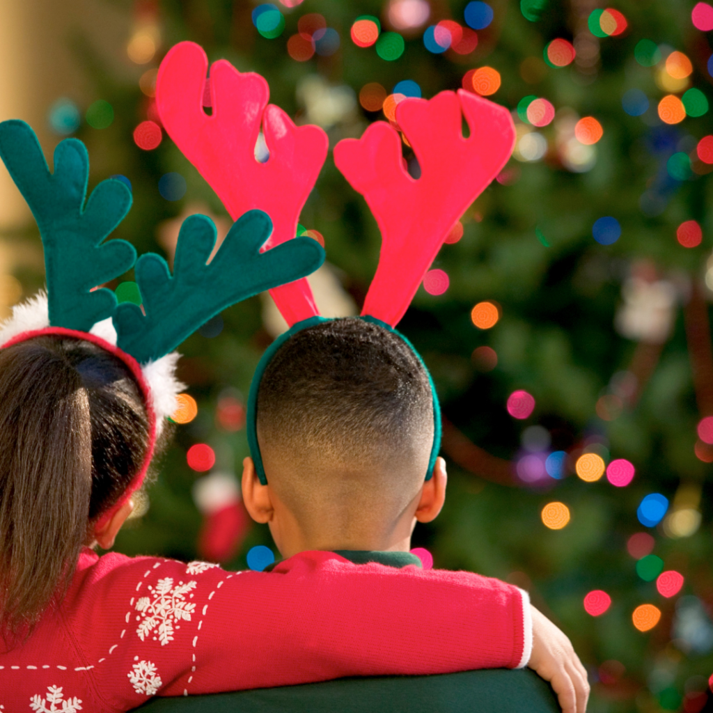 Two children providing emotional and behavioural support to each other at Christmas